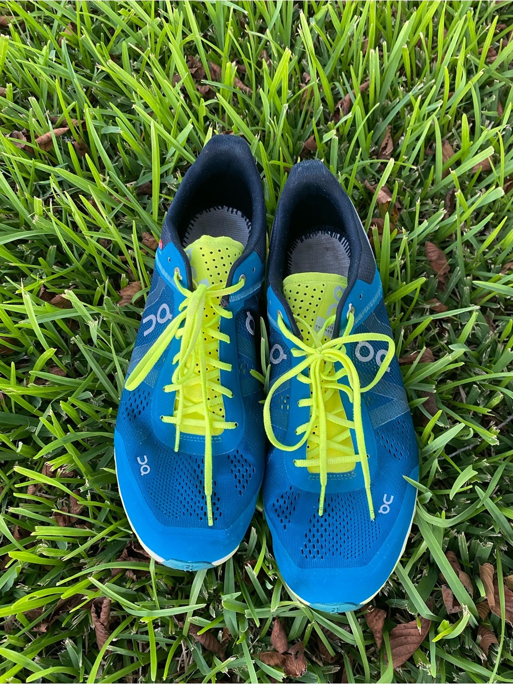 On Running Blue Athletic Shoes with Neon Yellow Laces